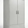 Closed gray outdoor electrical cabinet with double doors, side ventilation louvers, a sloped roof, and mounting feet