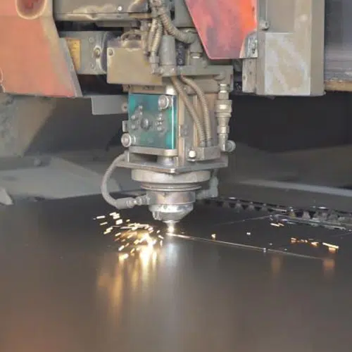 Laser cutting machine cutting sheet metal for an electrical enclosure
