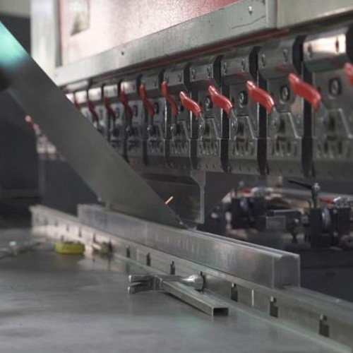 Press brake bending a sheet metal panel for an electrical enclosure
