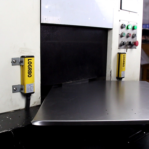 Corner forming machine shaping a sheet metal enclosure panel