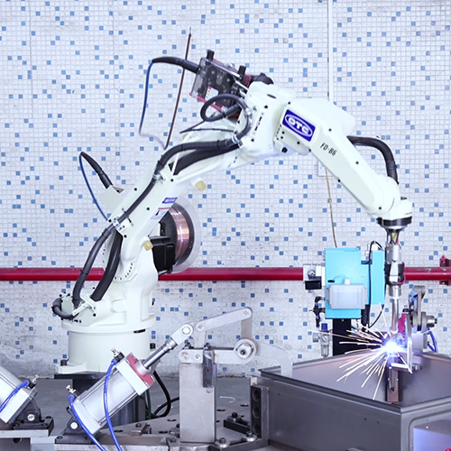 Robotic welding system joining a sheet metal electrical enclosure