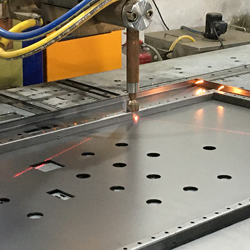 Spot welding machine joining sheet metal electrical enclosure panels