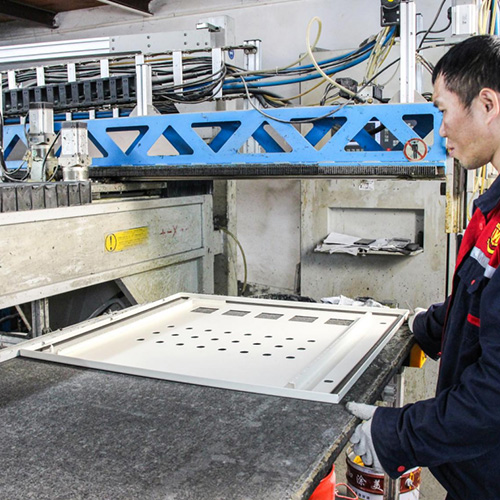 Automated foam gasket application on an electrical enclosure door