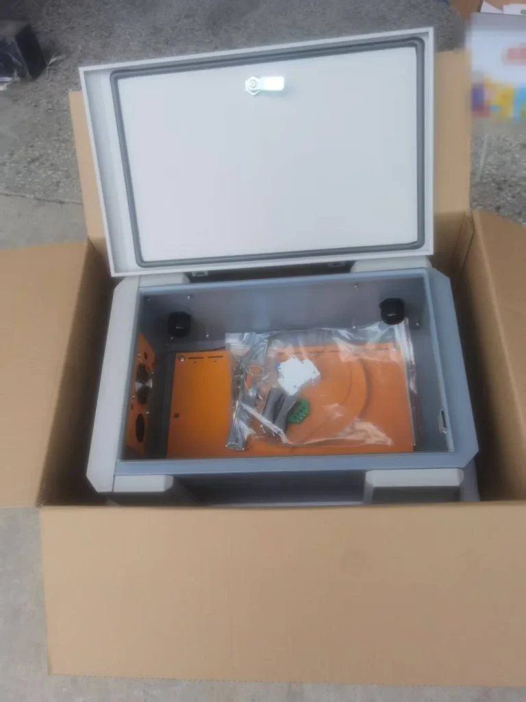 Outdoor electrical enclosure packed with foam supports and a separate accessory bag
