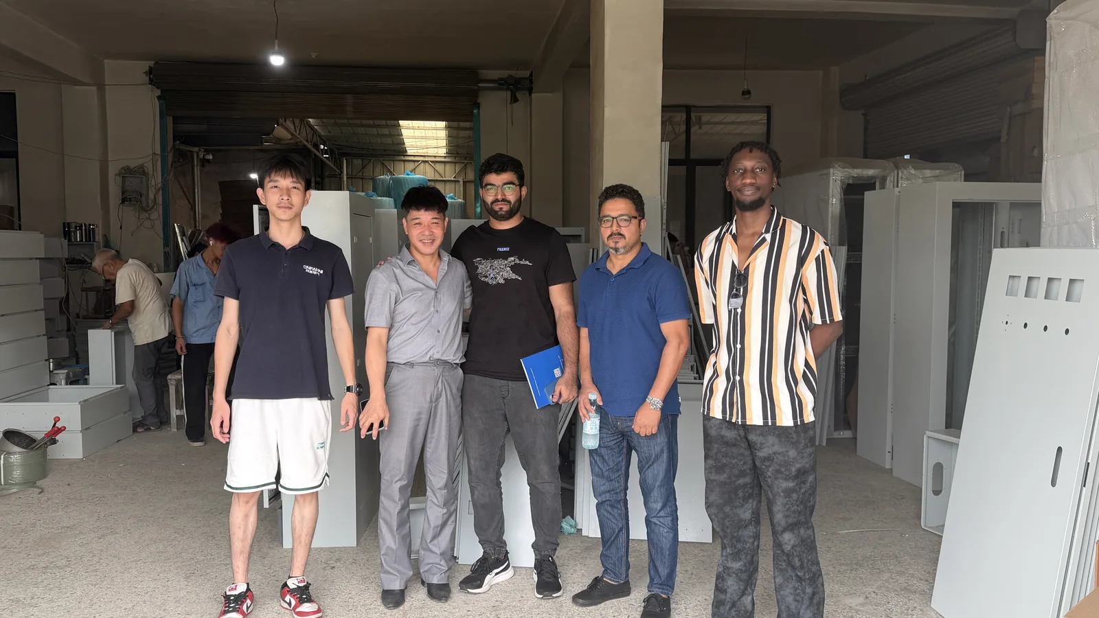 FN Enclosure team meeting international visitors during a factory visit