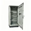 Open floor-standing outdoor electrical cabinet with internal mounting shelves and a ventilated door